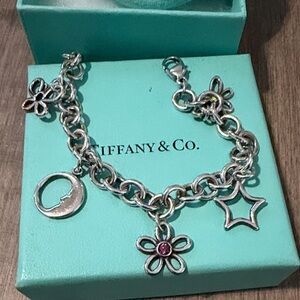 Tiffany & Co. Silver Bracelet with Floral and Star Charms